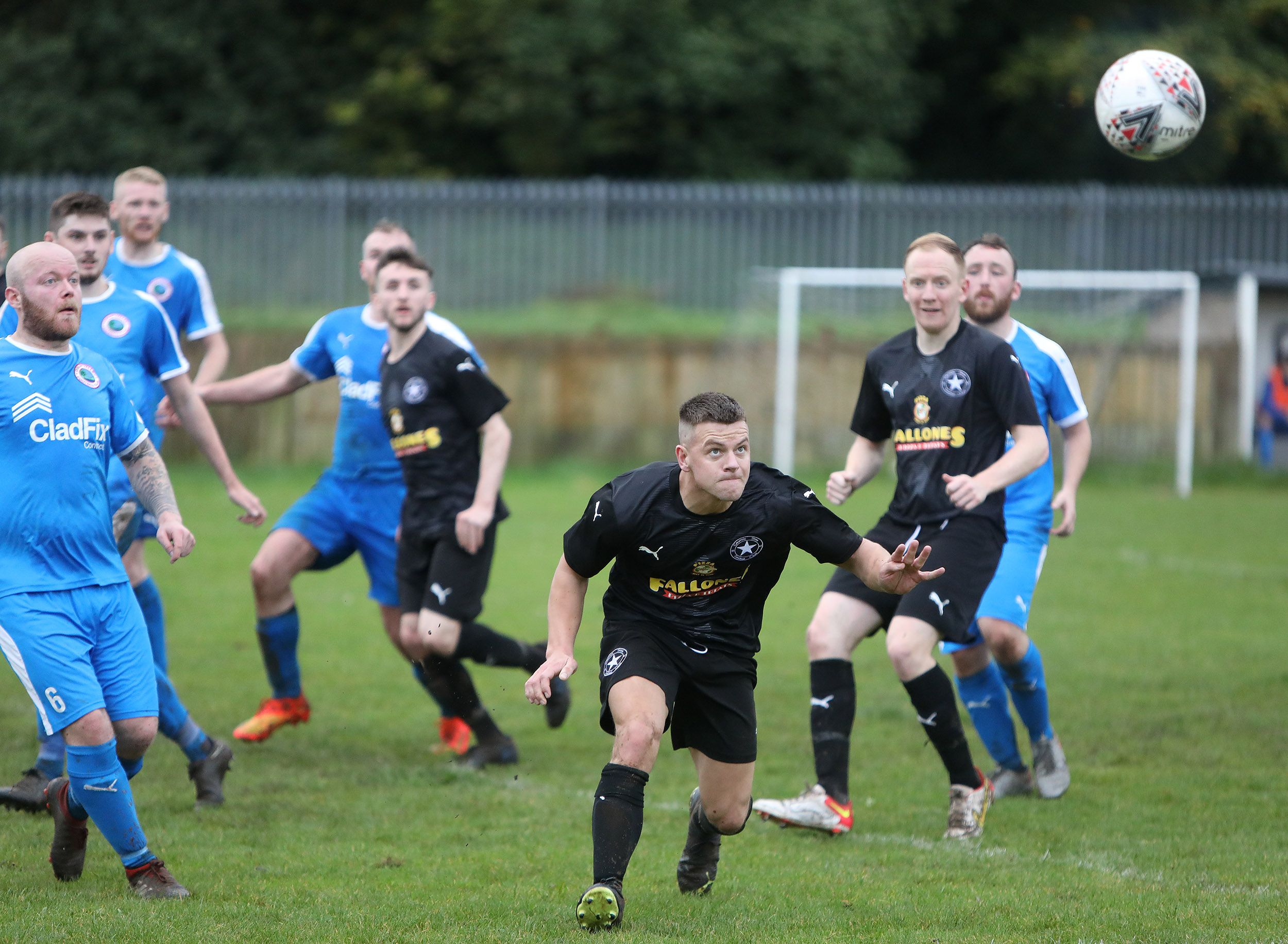 CRUMLIN STAR: James Doyle goes for a header in Saturday\'s 3-1 victory over Colin Valley