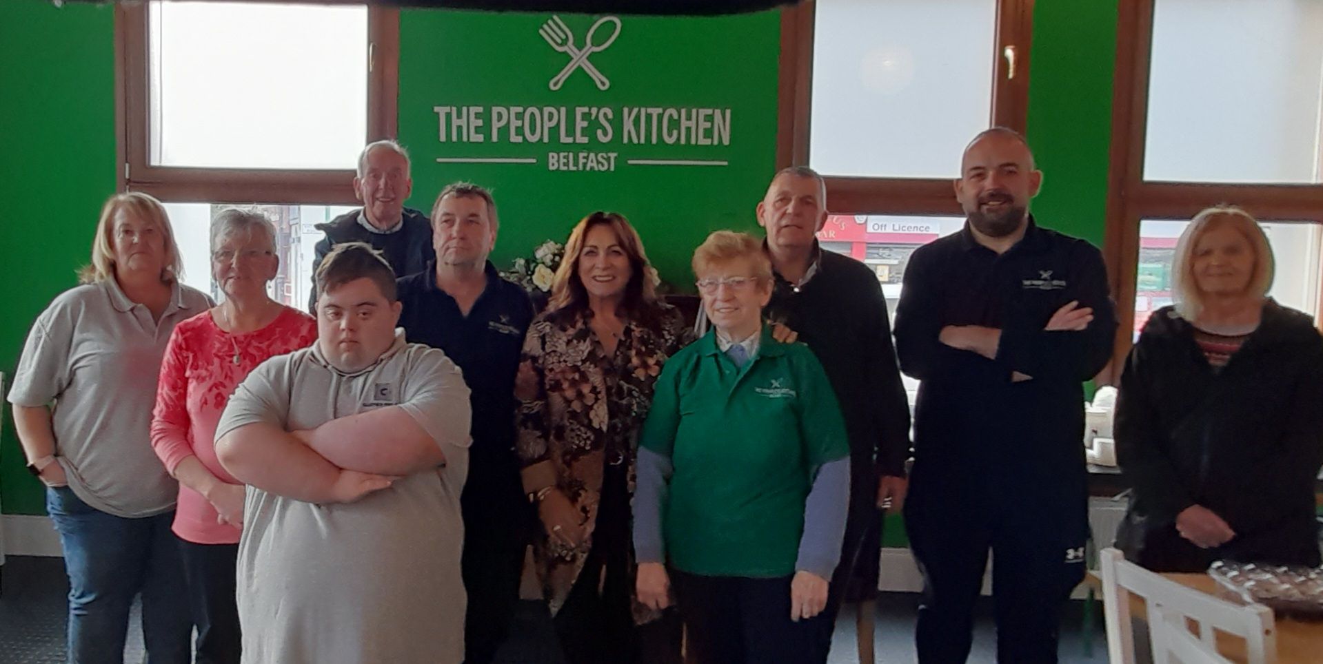 VISIT: Mary Black with staff and service users from the People\'s Kitchen on the Antrim Road