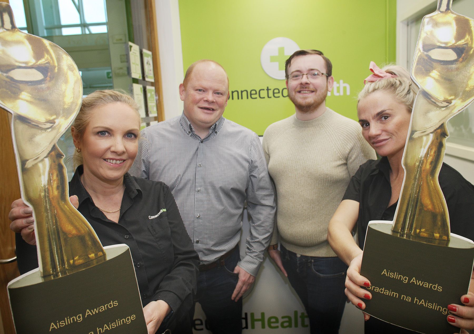 AWARDS: Julie Cordner and Claire Adams from Connected Health with 2021 Community Builder Award winner Colm Fanning (Lagmore Youth Project) and James McCarthy (Belfast Media Group)