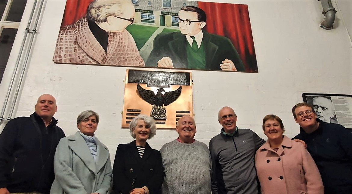ICON: Fra McCann with members of Fr Des Wilson’s family under a portrait of the much-loved priest