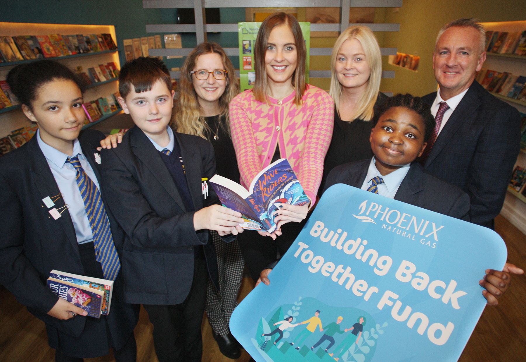 BOOKS: Rebecca Dalzell (centre) and Lucy Lewis from BookTrust visited St. Colm\'s to hand over the books