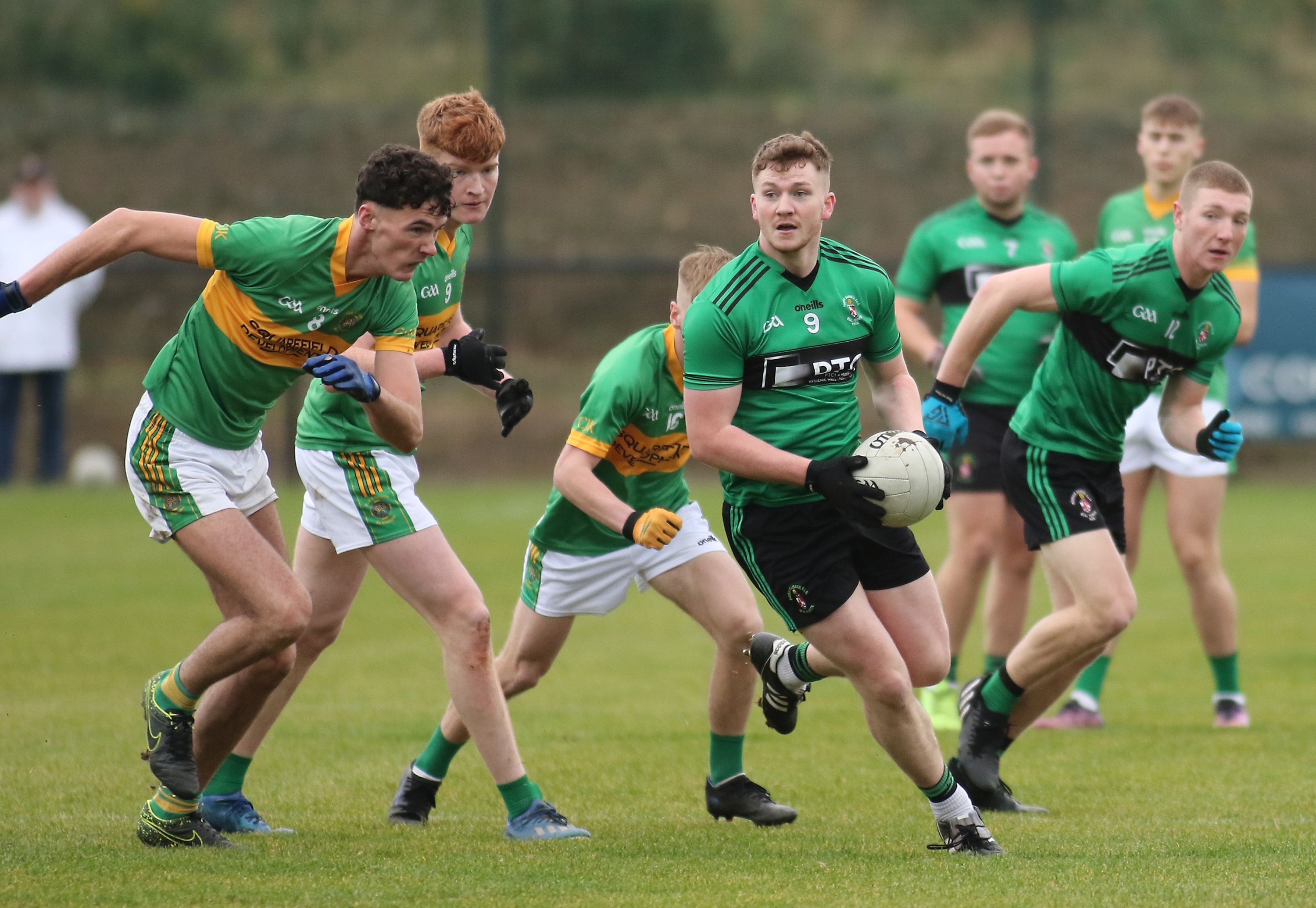 Joe McNally is chased down during Saturday\'s Antrim U20 B football final at Dunsilly that was won by Creggan 