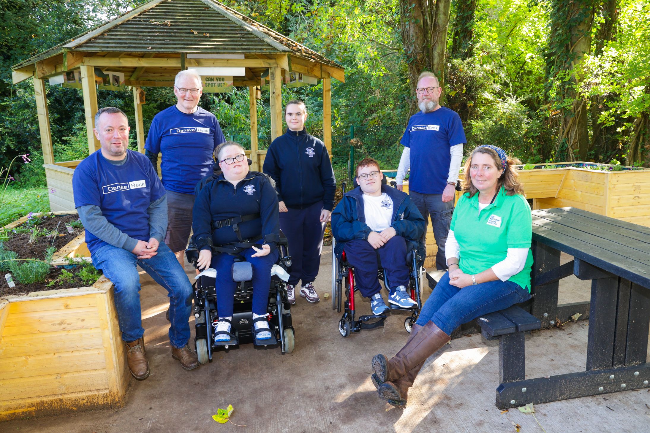 NEW SCHOOL GARDEN: John Connaughton and Ian Downes with Fleming Fulton pupils Karis, Heidi and Head Boy Mackenzie, Kevin Starkey from Danske Bank and Jilly Dougan.