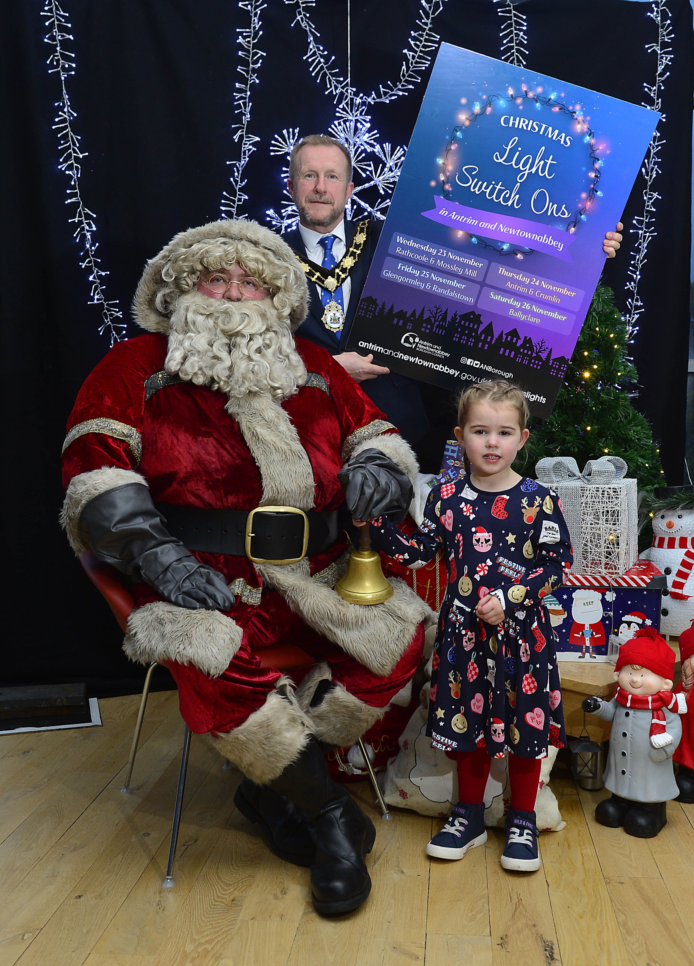 CHRISTMAS READY: Santa Claus joins the Mayor of Antrim and Newtownabbey, Alderman Stephen Ross and little Ruby Norris to launch the Christmas Light Switch Ons.