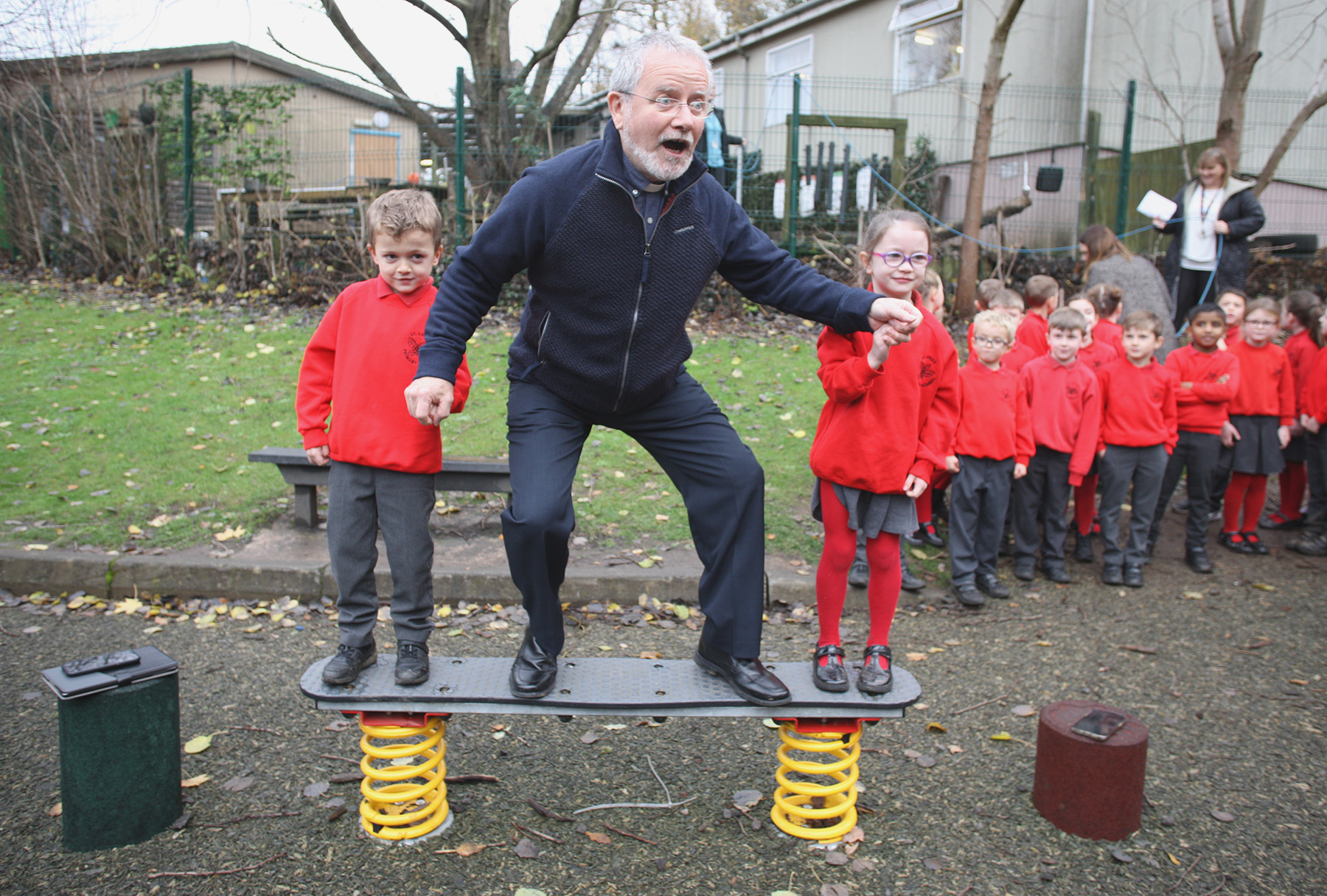 BLESSING: Parish Priest Fr Peter O'Hare joined staff and students to bless the new equipment 