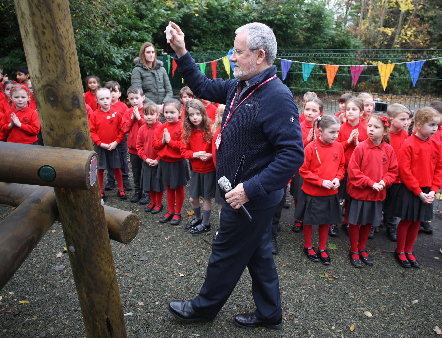 BLESSING: Parish Priest Fr Peter O'Hare joined staff and students to bless the new equipment 