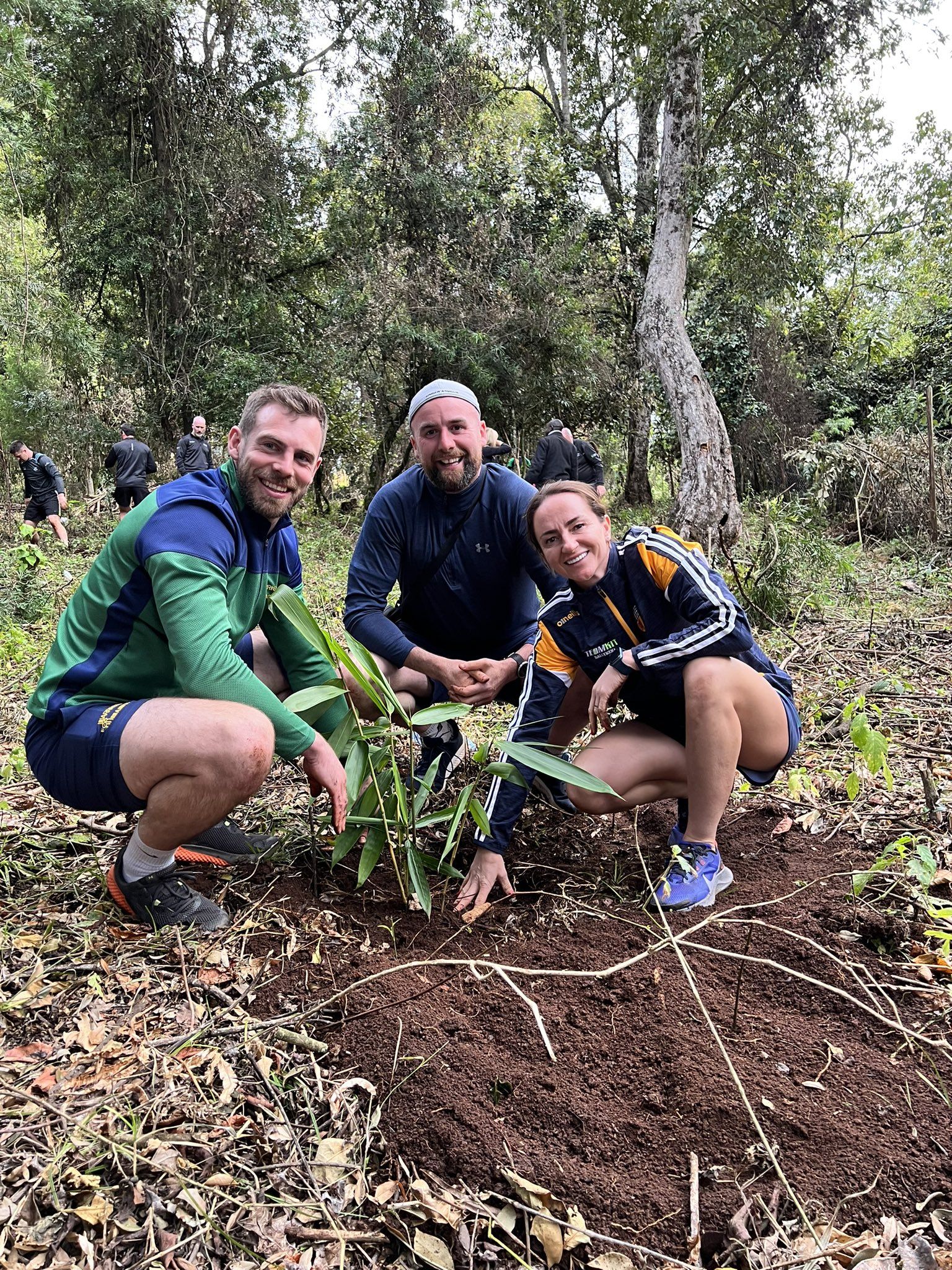 PLANT THE PLANET: Antrim GAA stars, hurler Neil McManus, camóg Jane Adams and footballer Chris Kerr plant trees in Kenya