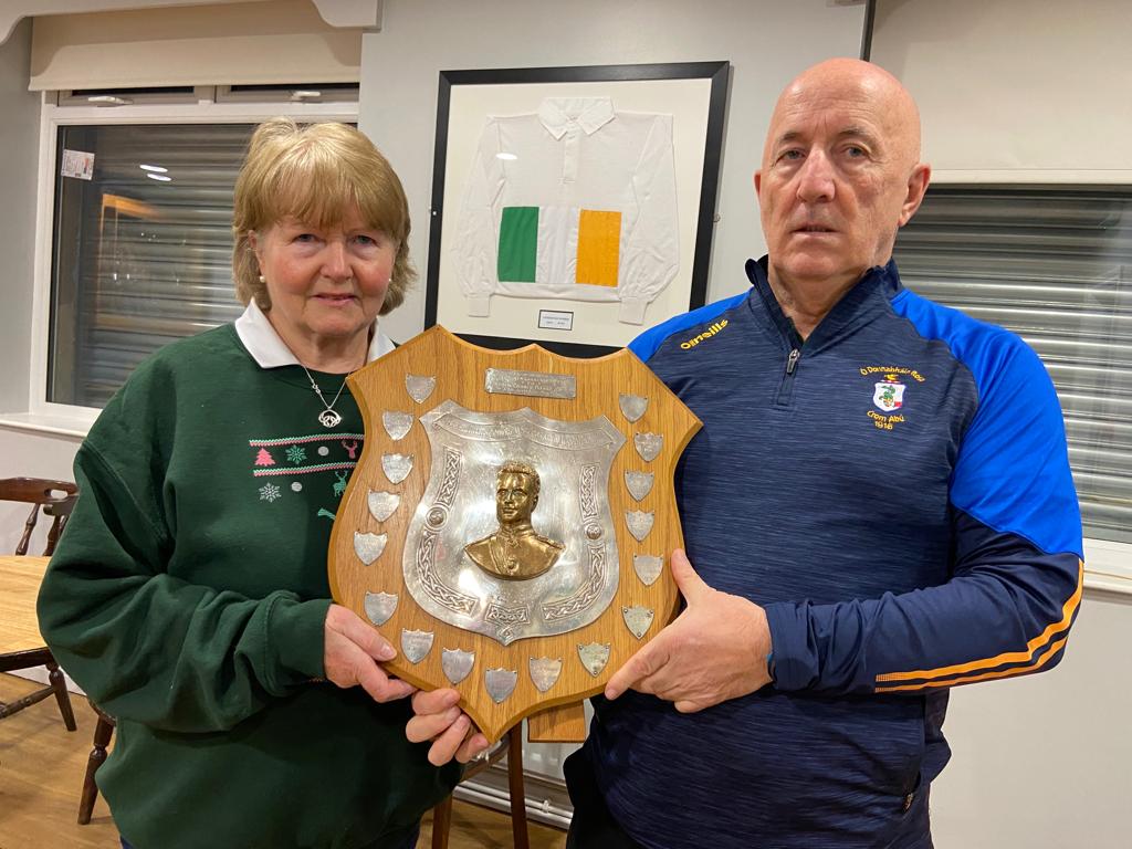 CENTENARY: Margaret Flynn and Gerard Armstrong of O\'Donovan Rossa GAC with a commemorative shied in front of an old Rossa jersey