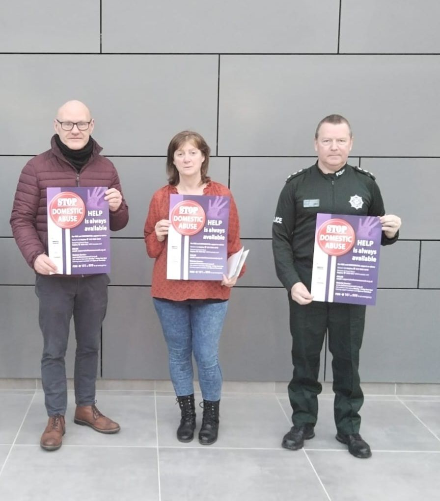 HELP AT HAND: Paul Maskey MP is joined Mary McArdle from the Falls Community Council and Chief Inspector Peter Brannigan to launch the new initiative
