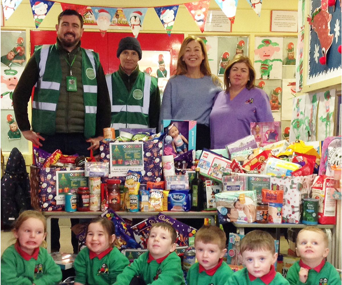 DONATIONS: Paul Doherty and Michael Flynn from Foodstock alongside Mrs Kielty (Acting Principal) and Mrs Dellott, from Holy Child Nursery School