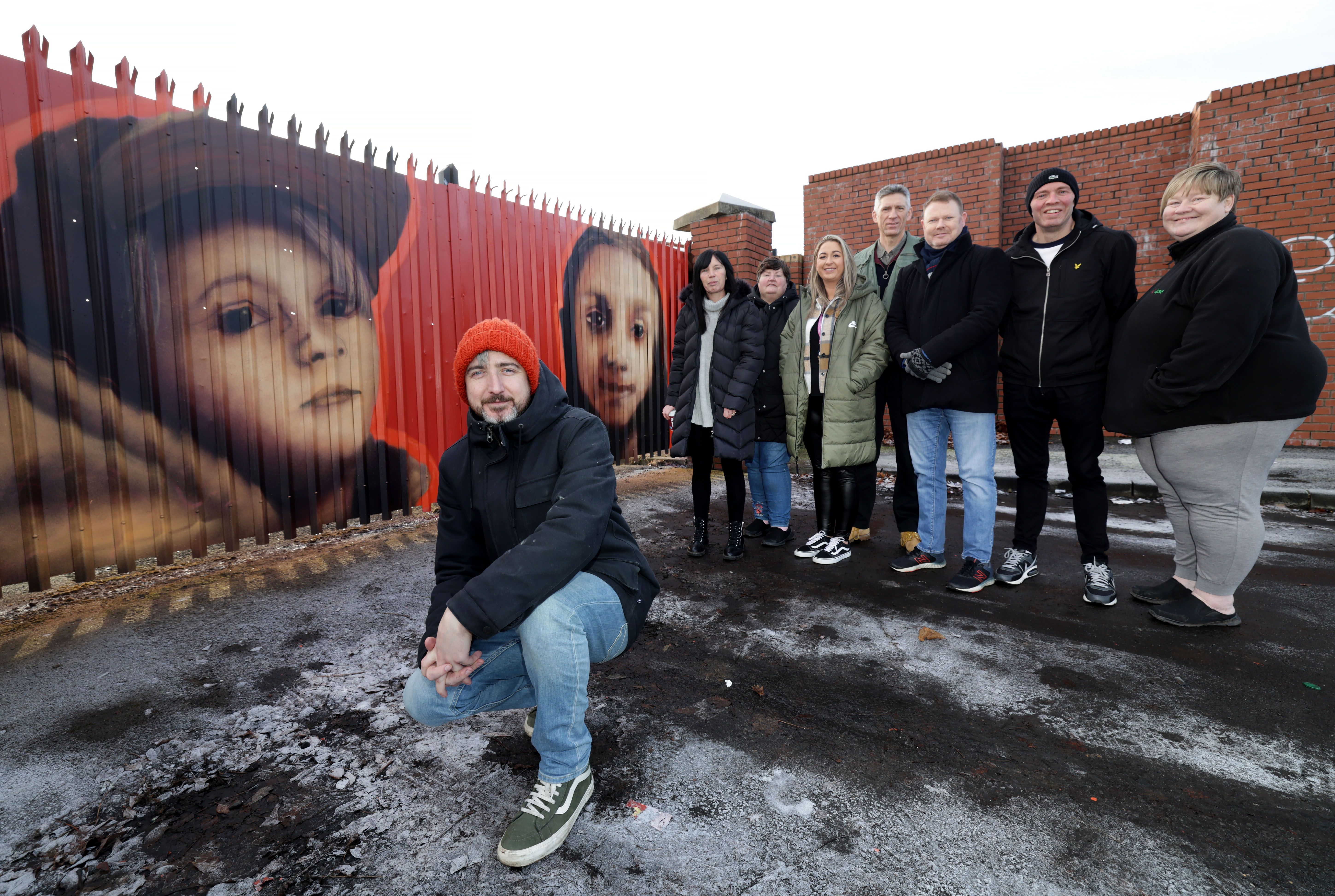 ART: Artist Emic (Eoin McGinn) with Terry Donaghy, Suffolk Community Forum; Rachel McDougall, Vicky Johnston and Louise Veal from Suffolk Events Circle; John Hoey from Stewartstown Road Regeneration Project and Andrea Muldoon, Kids Together