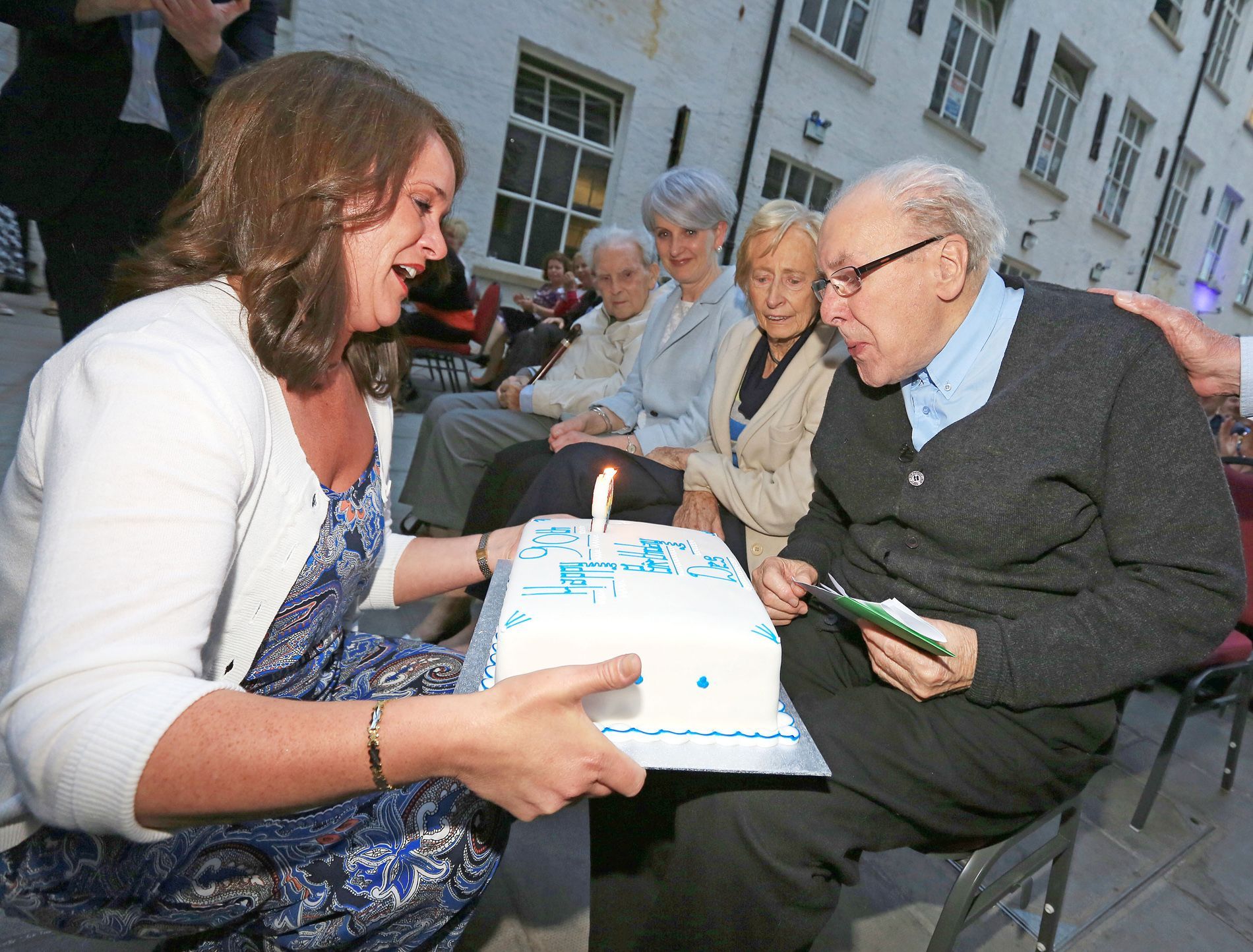 Fr Des blows out candles as friends celebrate his 90th birthday in 2015, four years before his death