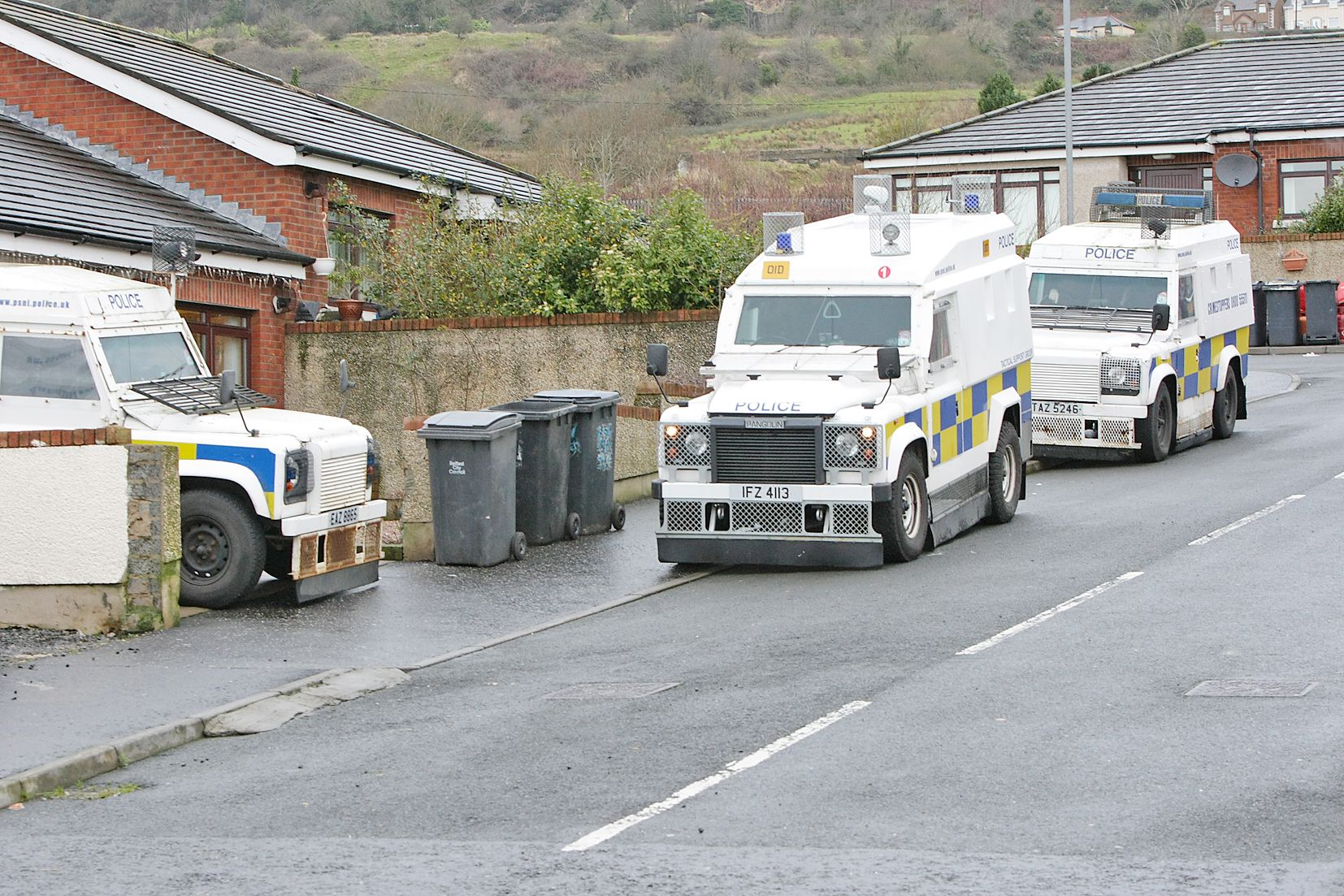 FAMILIAR: Police at the Travellers’ site on the Glen Road – mincéirí face endemic discrimination