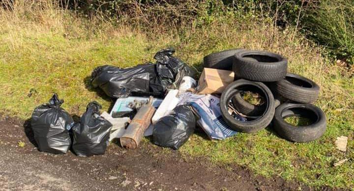 BLIGHT: Rubbish an tires dumped on the Mountain Loney
