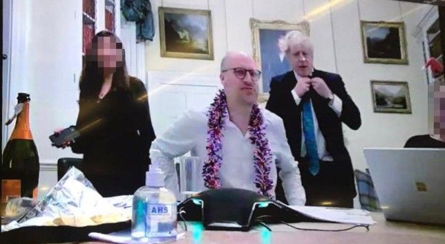 NOT AGAIN: Boris Johnson with three members of staff, one wearing tinsel and another a Santa hat, in December 15, 2020 