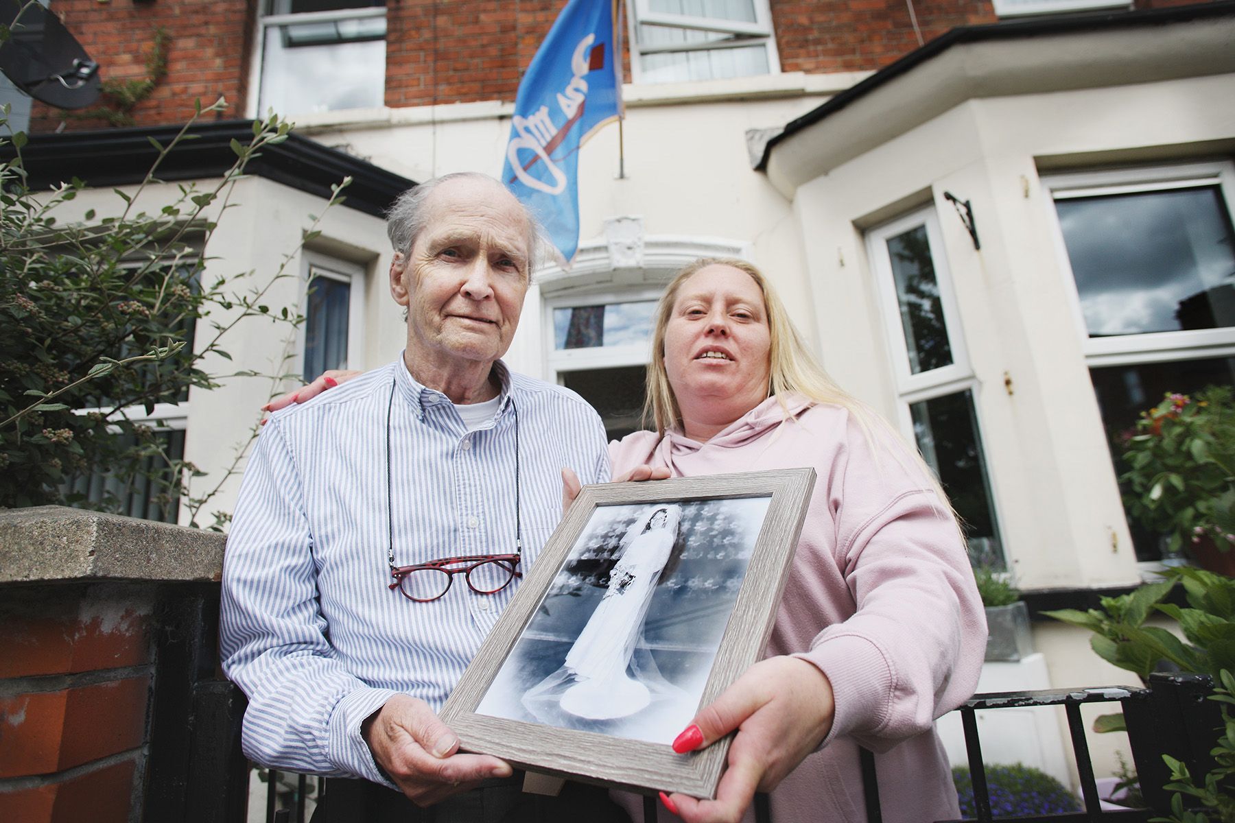 CAMPAIGNERS: Áine McCabe with her father Jim, holding a framed photo of Norah McCabe