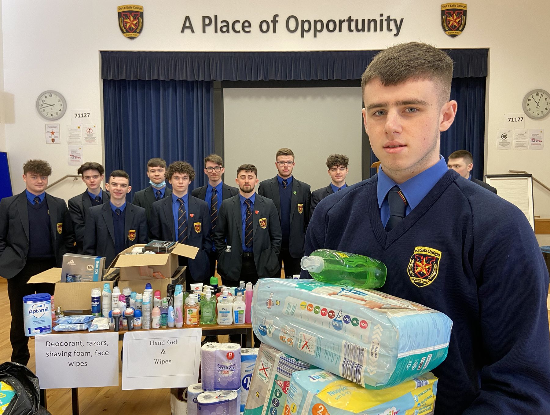 DONATIONS: Ciaran Cassidy and the sixth form students from De La Salle College with some of the donations they have collected