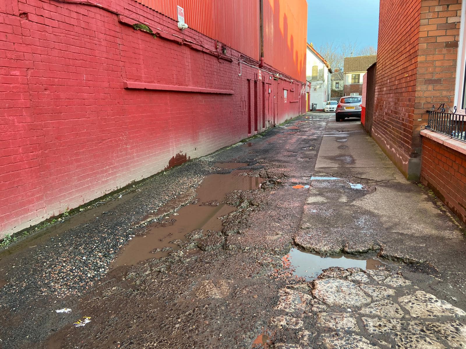 REPAIR WORK GREEN LIGHT: The road outside Solitude, home of Cliftonville FC, is badly potholed
