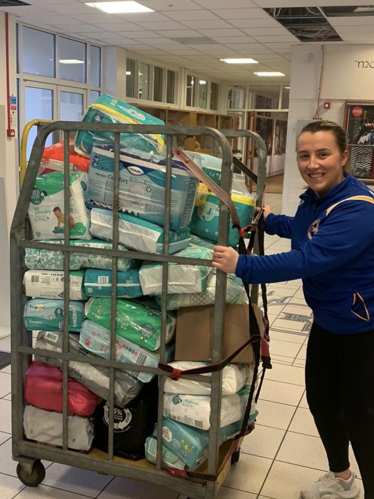 DONATIONS: Business Studies teacher Emma Mone with the donations collected by the Edmund Rice College community