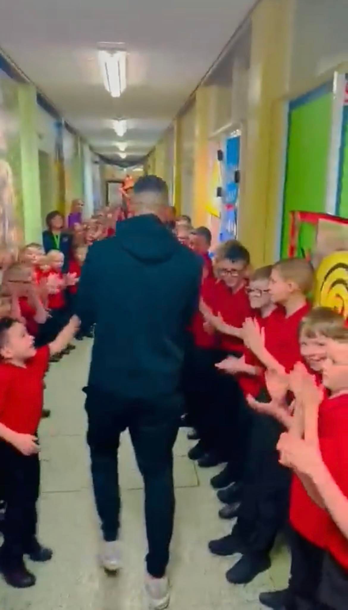 JOY: Cliftonville striker Joe Gormley was greeted with a rapturous reception as he turned up for work at Holy Cross Boys PS on Monday morning