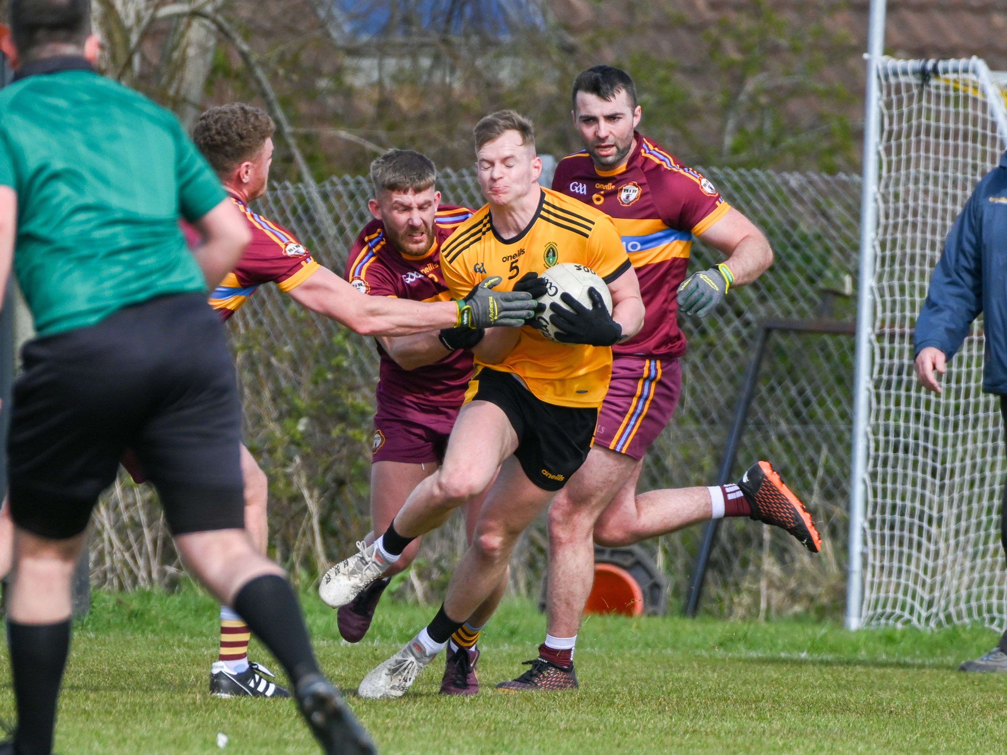 peter healy is challenged during Sunday\'s game 