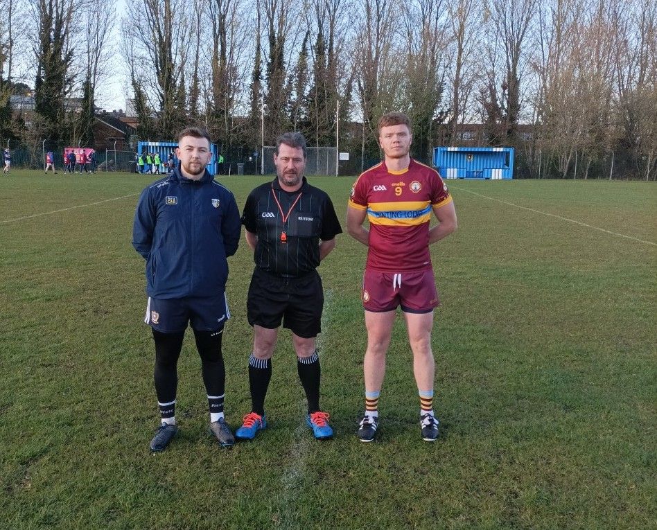 The captains with referee Mark O\'Neill before the game 