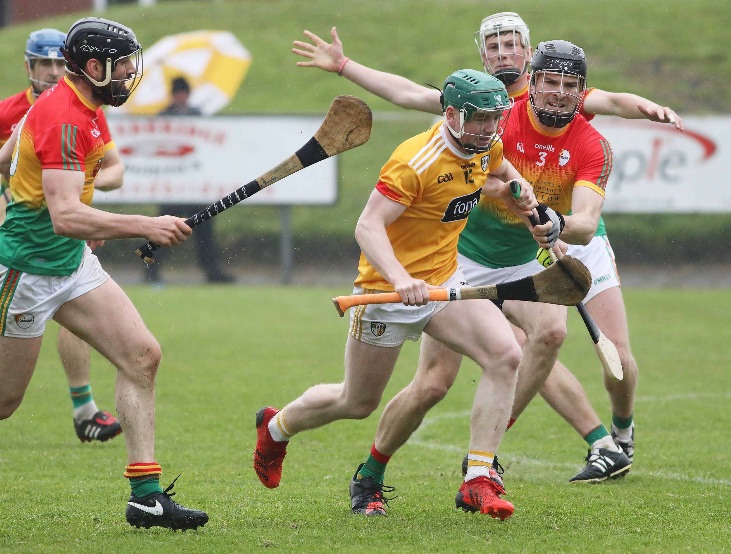 Conal Cunning is challenged by Conor Lawlor at Corrigan Park on Saturday