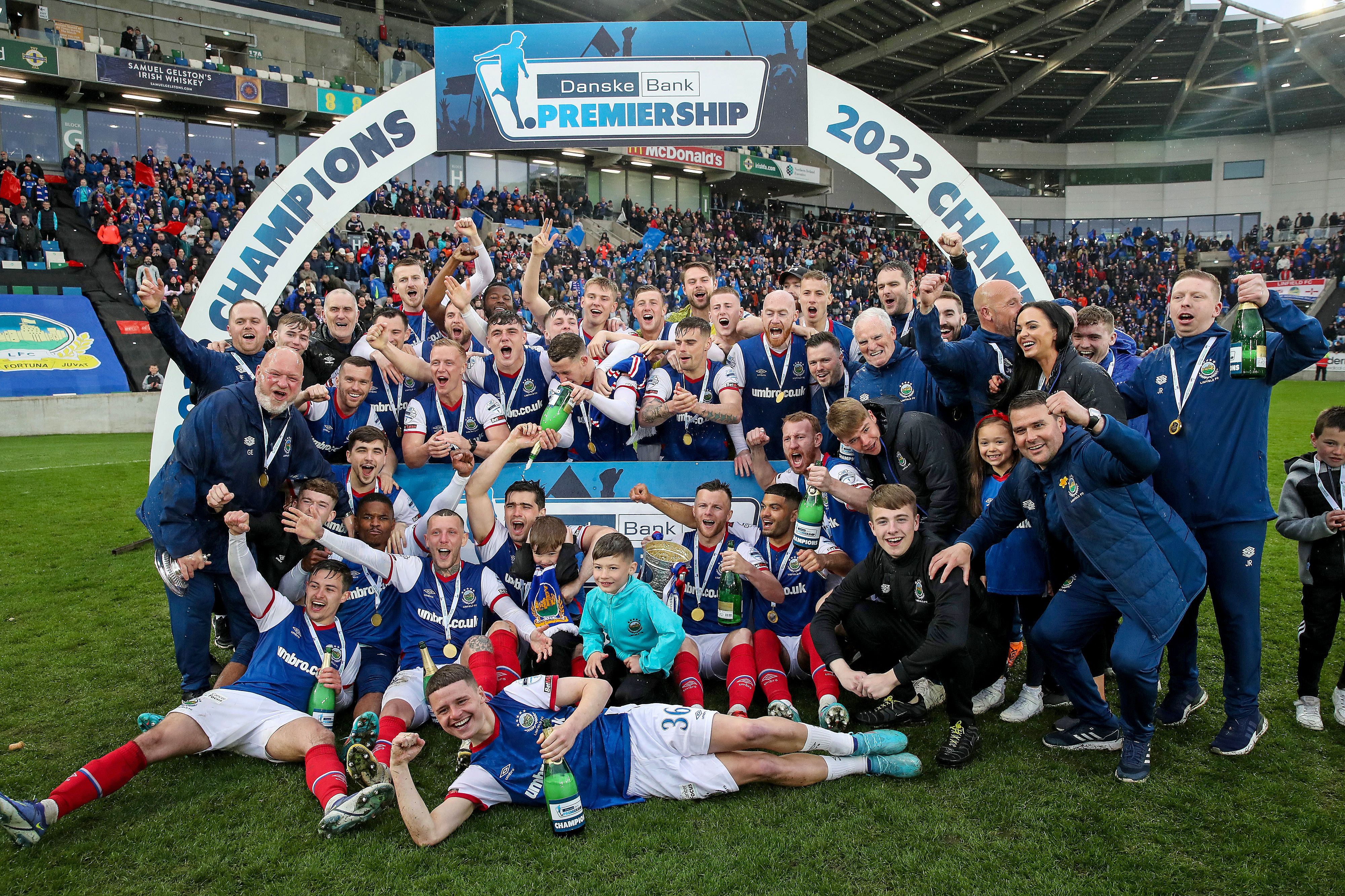 Linfield celebrate retaining the Gibson Cup with a 2-0 win over Coleraine that rendered Cliftonville\'s win at Glentoran redundant