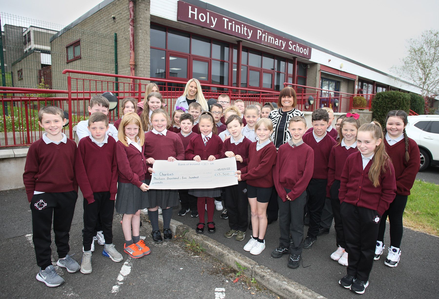 FUNDRAISING: Pupils from Mrs Donnelly\'s P5HD class with principal Fiona Boyd and the cheque for £13,500