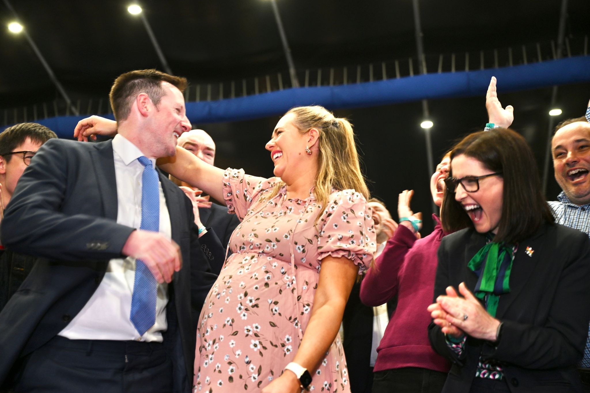 SUCCESS: Heavily pregnant Kate Nicholl celebrates her election success with her husband Fergal Sherry and fellow South Belfast MLA, Paula Bradshaw