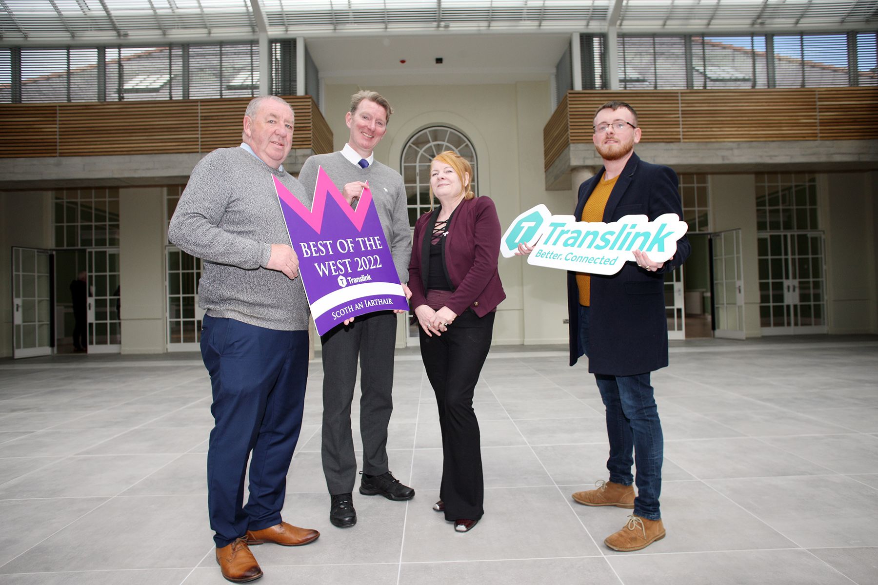 ON BOARD: Gerry McConville, Chairman of the Falls Community Council with Damian Bannon (Translink), Marie Maguire, Deputy Chair of the Falls Community Council andBelfast Media Group\'s James McCarthy 