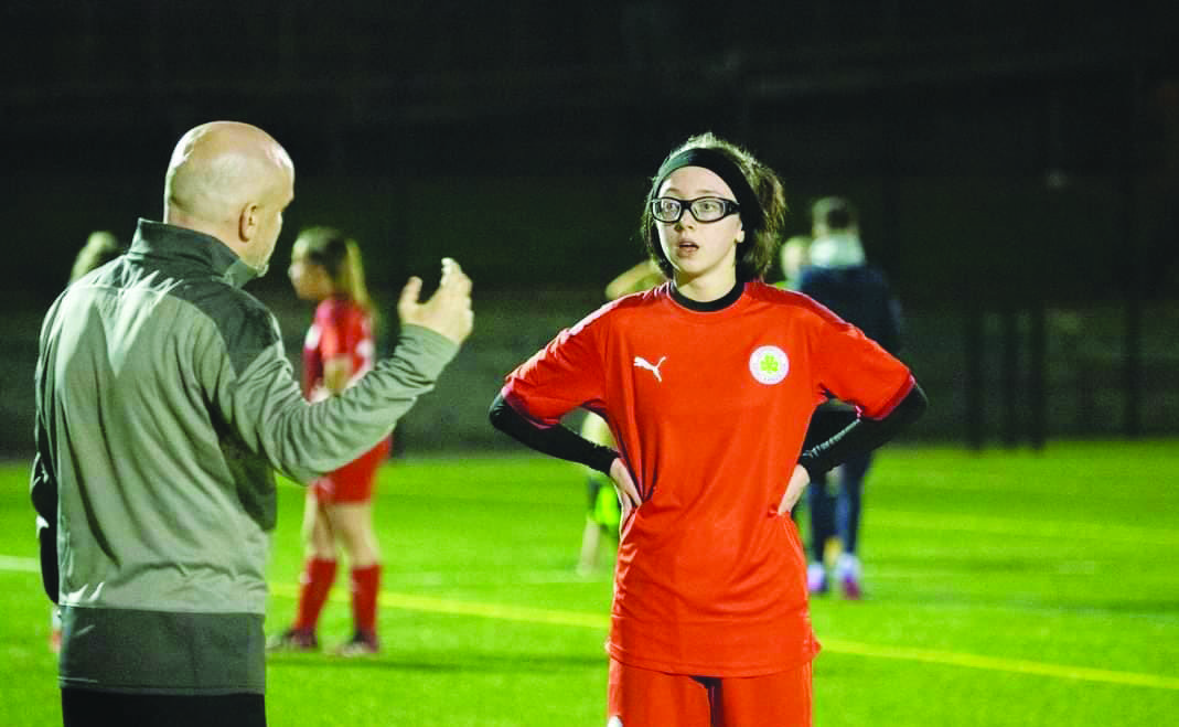 Nick Casey chats to one of his Cliftonville U15 players