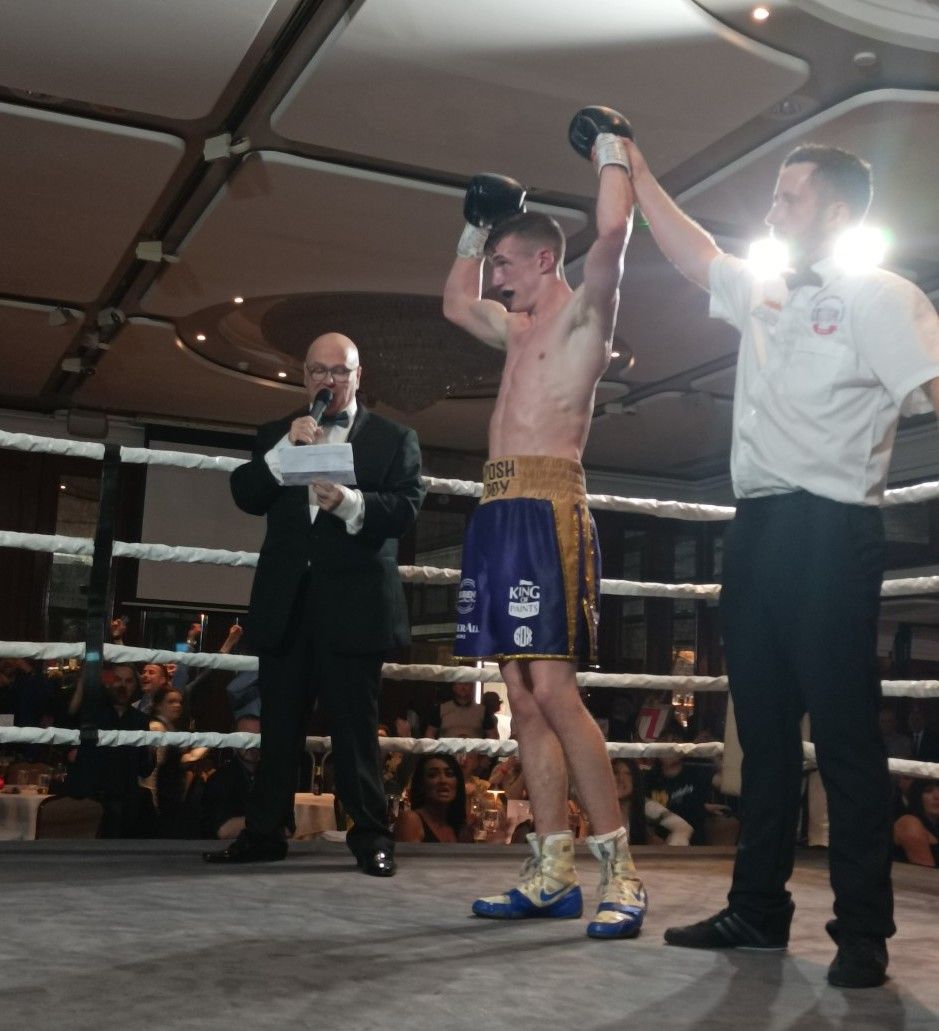 Colm Murphy has his hand raiased by referee Hugh Russell Jnr 