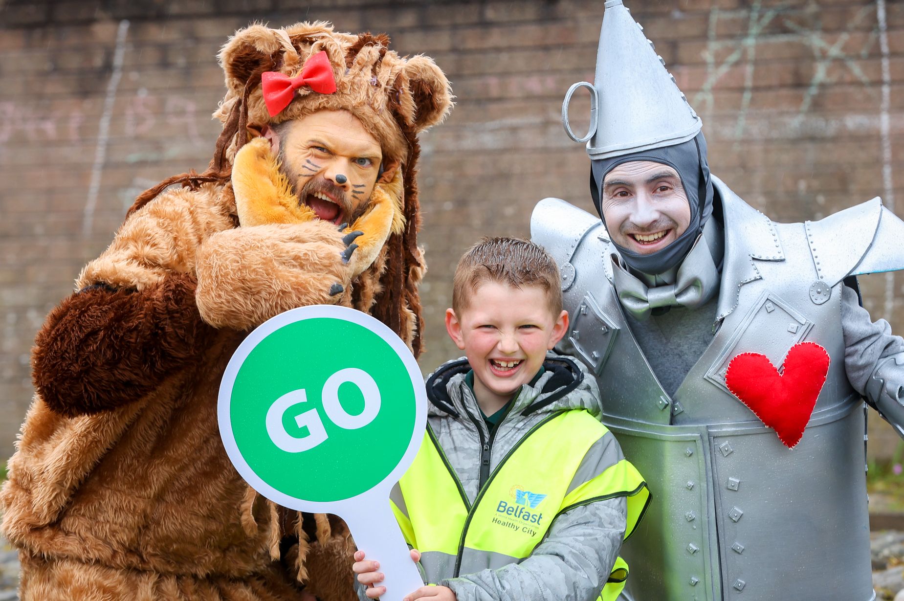 WALK TO SCHOOL: Sacred Heart Boys PS pupil Dylan Burns with the Tin Man and the Lion