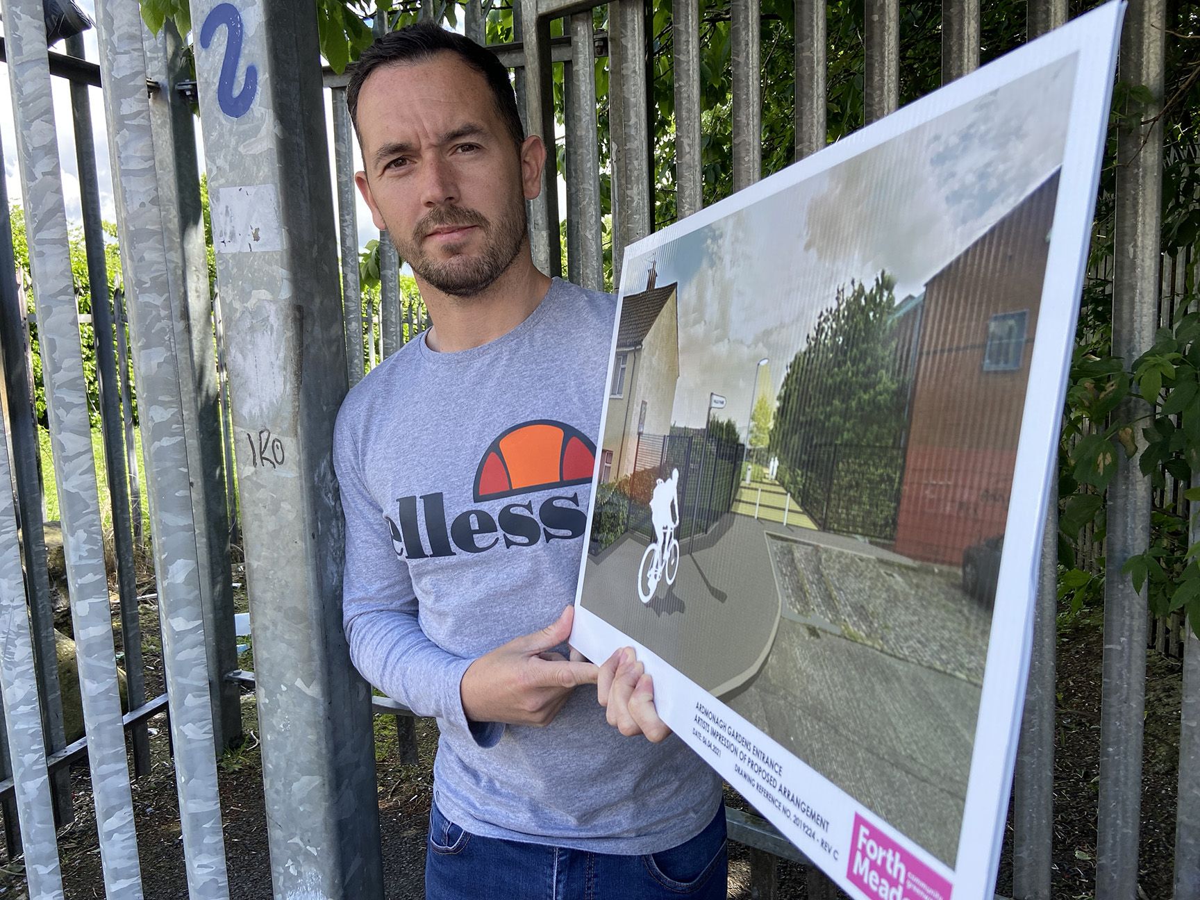 FUTURE VIEW: Cllr Michael Donnelly with an image of how the new entrance will look