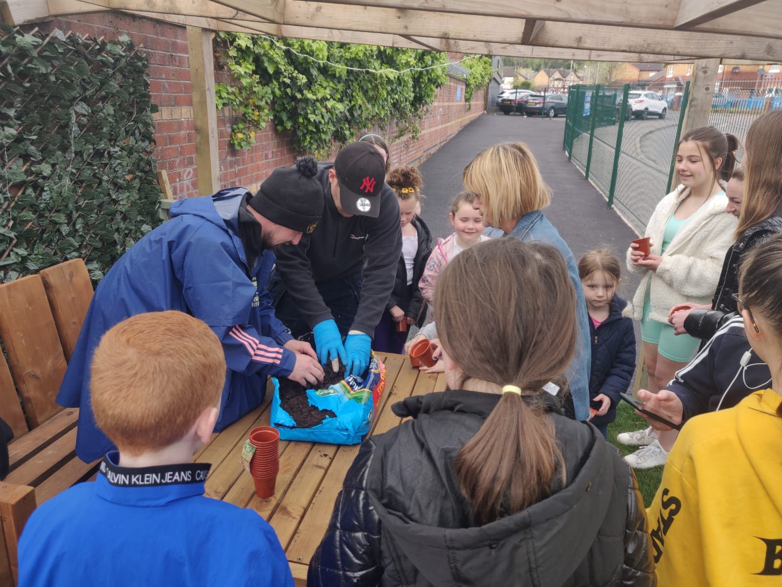 GREEN FINGERS: Locals learning gardening skills at the Beechmount Grove Community Garden