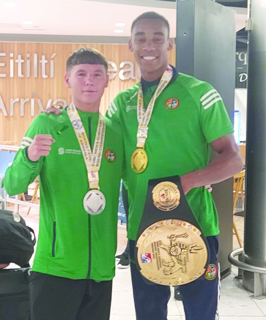 Dylan Eagleson (left) and Gabriel Dossen as they arrived home at Dublin Airport on Tuesday with silver and gold medals respectively at the European Championships