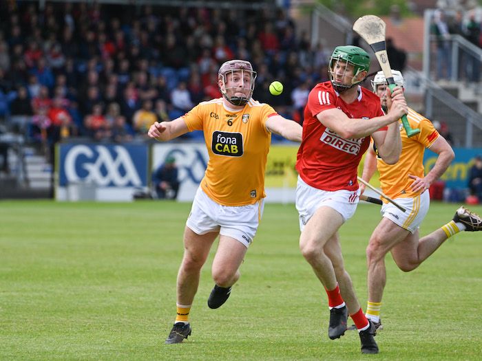 Eoghan Campbell - who recovered from injury to captain the Antrim team on Saturday - puts in a challenge on Seamus Harnedy