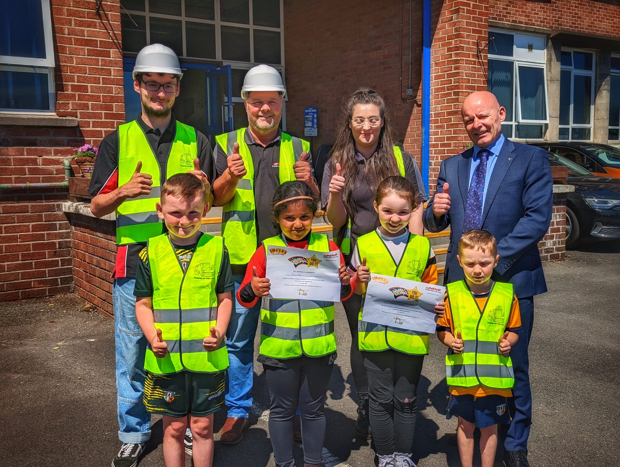 SAFETY: Adam Girgin, Eimear Mezza and Rob Lappin from EJC Contracts with Principal Kieran Austin, pupils Joshua McGreevy, Caoimhe Connolly, Aimey Anish and Ronin Murphy.