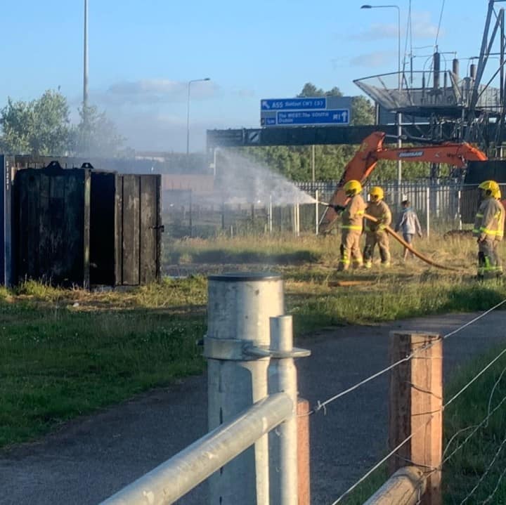 DISGUST: The Fire Service extinguish the blaze at the Bog Meadows