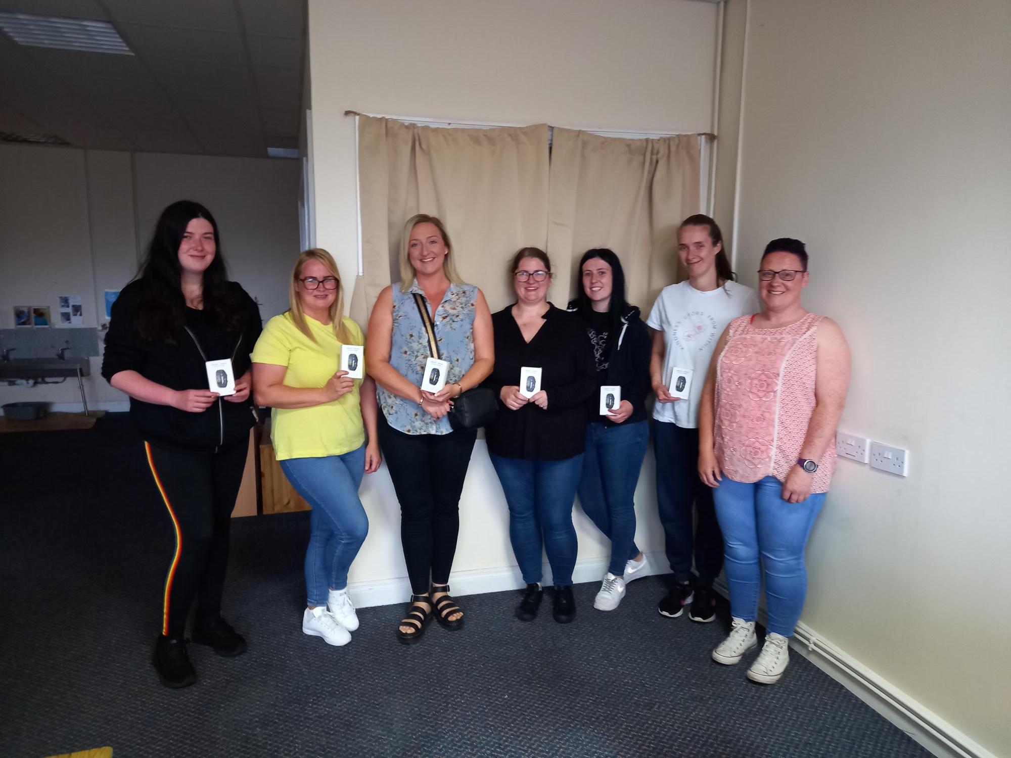 BEST FOOT FORWARD: Parents who took part in Saol Úr SureStart\'s 50km challenge were presented with FitBits for their efforts