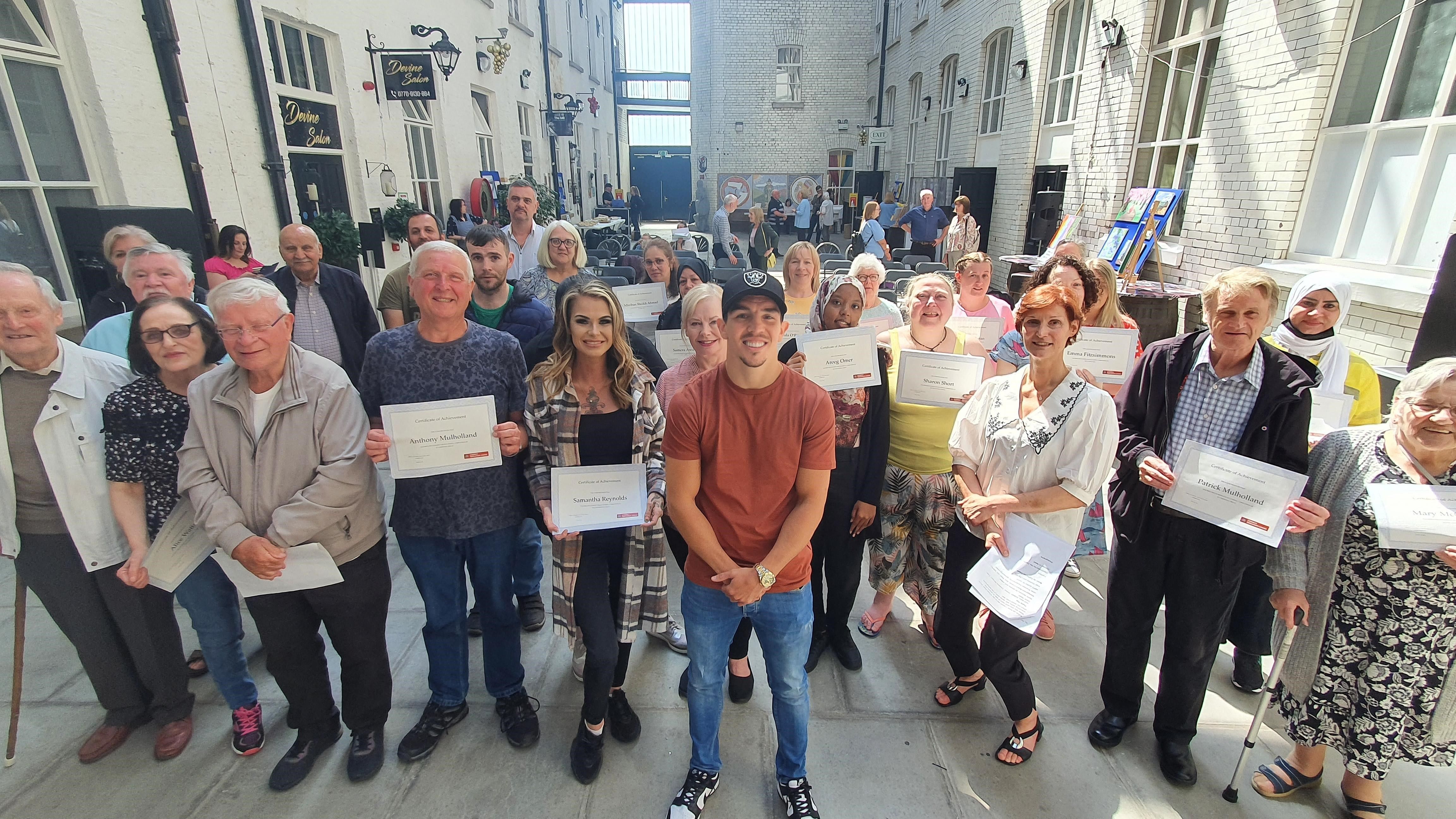 CHAMPIONS: Boxer Michael Conlan with the graduates at Conway