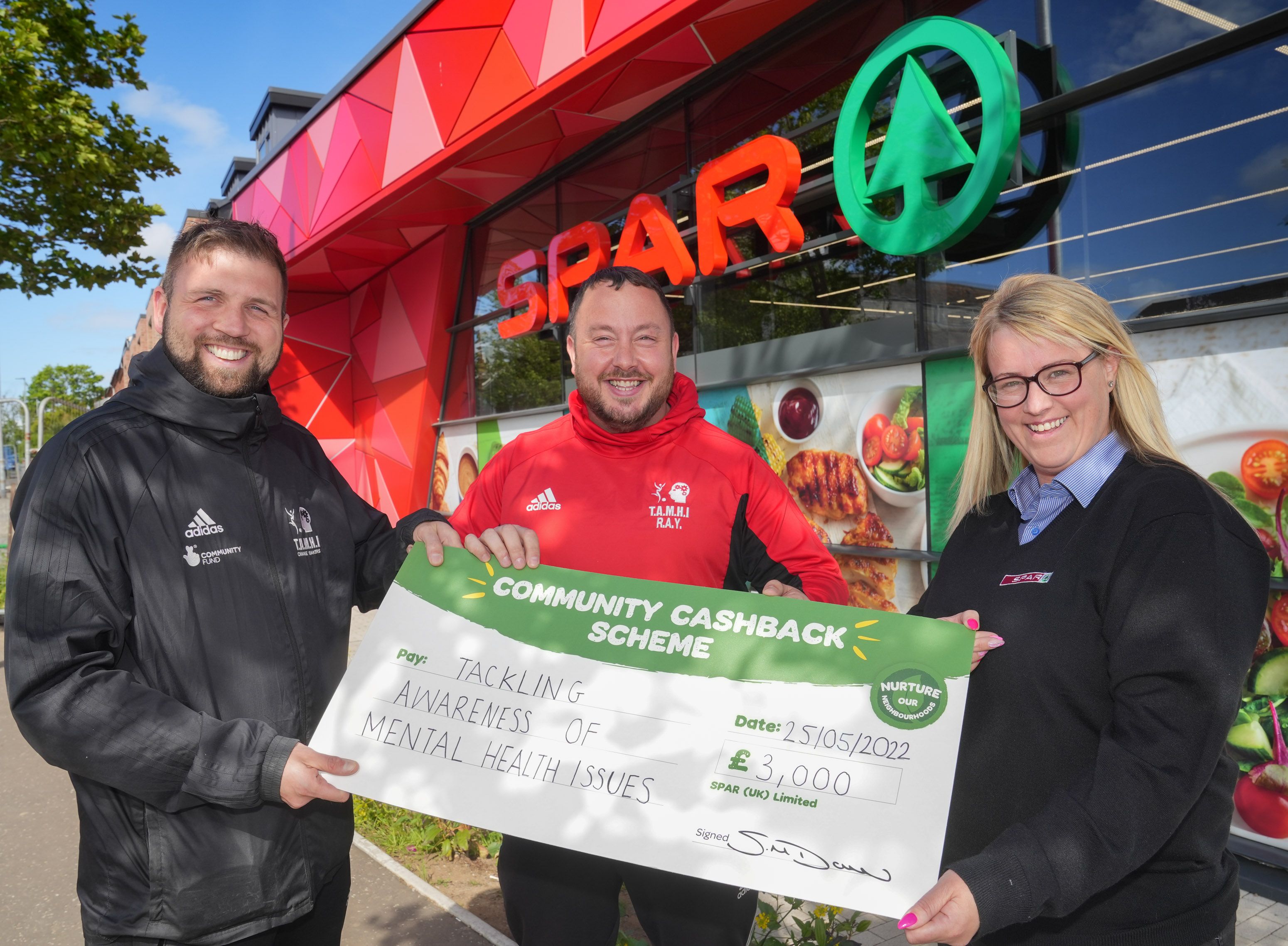 FUNDING BOOST: Joe Donnelly, CEO, and Mickey Meehan, Youth Coordinator from Tackling Awareness of Mental Health Issues (TAMHI), with Kelly Hayes from SPAR NI