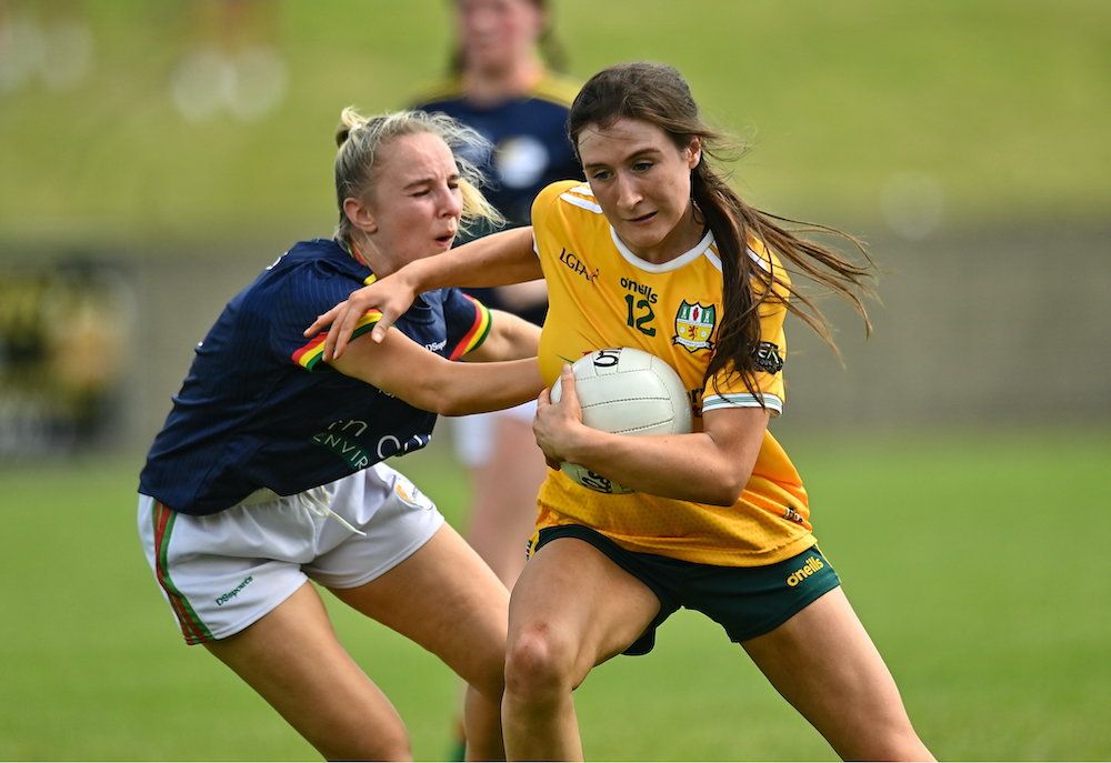 Maria O\'Neill bursts past Ellen Athkinson on Sunday 