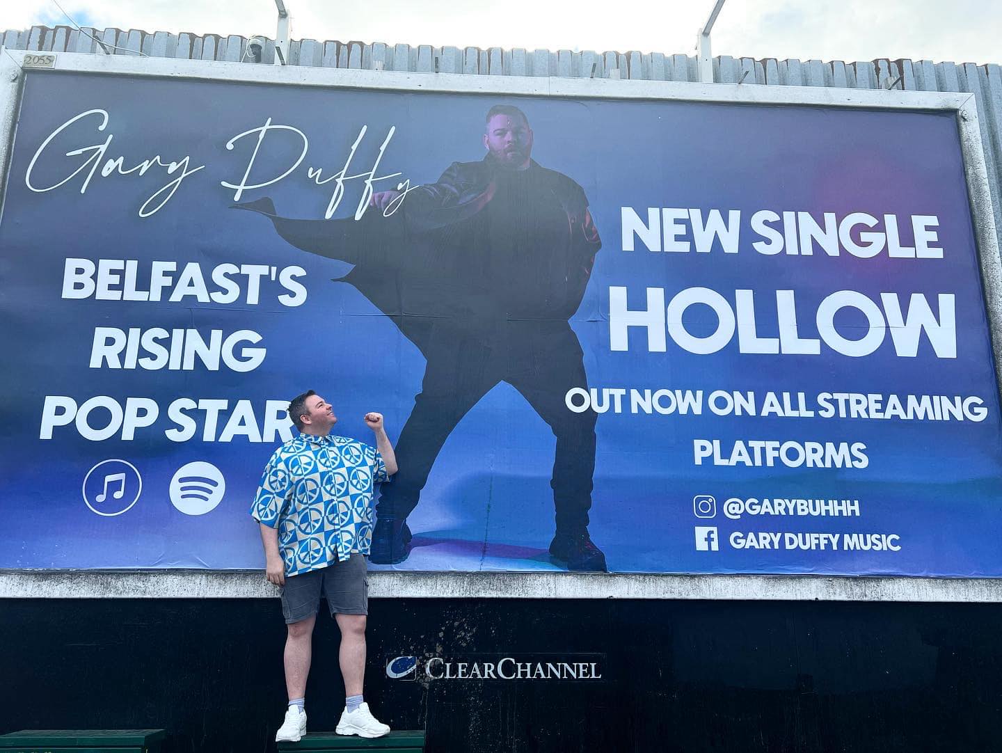 MUSIC FAME: Gary Duffy (30) at his new billboard in Belfast city centre