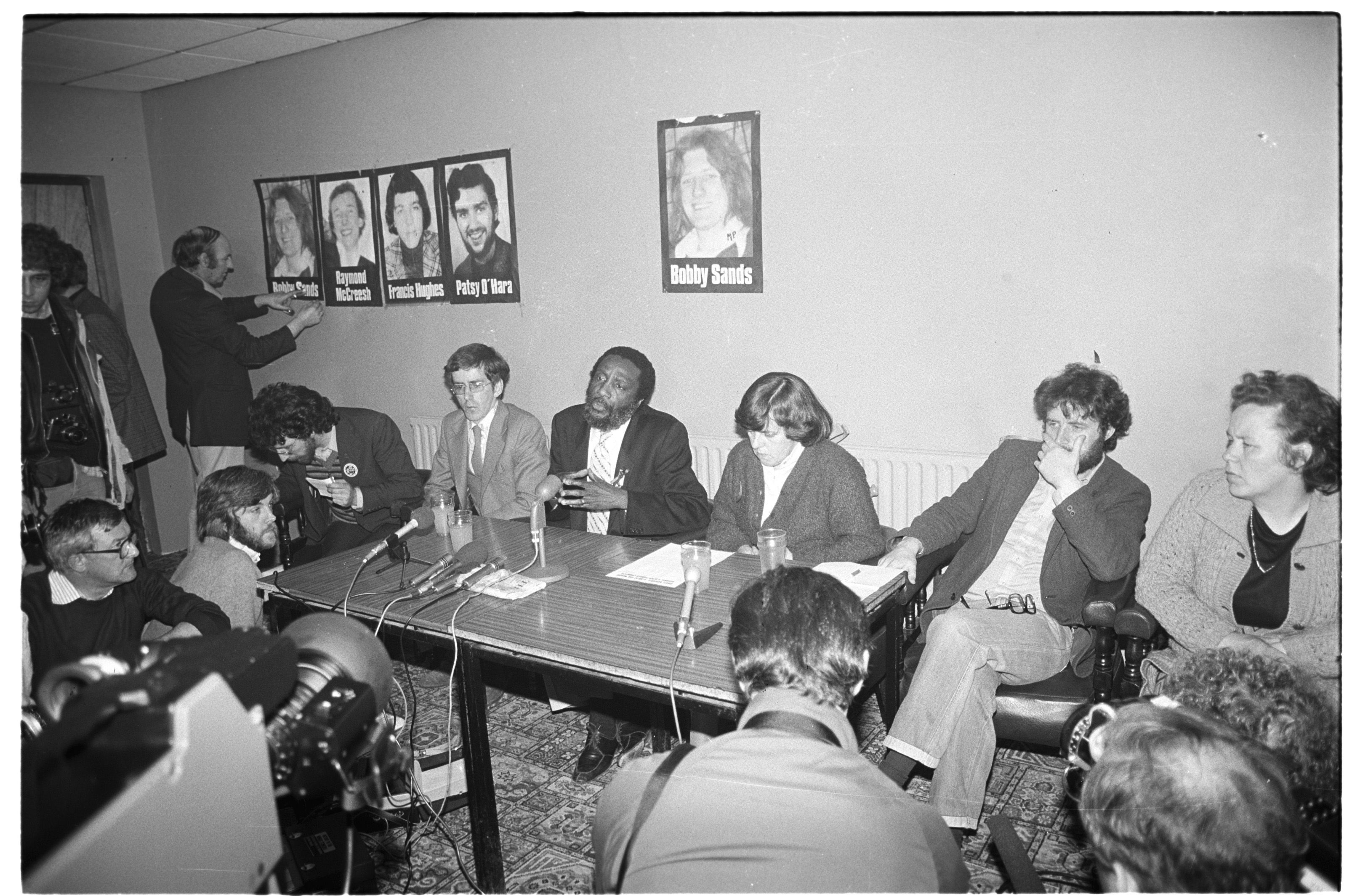 PODCAST: Bernadette Devin McAlliskey, Fergus Ó Hír, Maura McCrory, Dick Gregory (American comic and hunger strike protestor), Jim Gibney at a press conference in the Glen Inn with members of the H-Block Committee