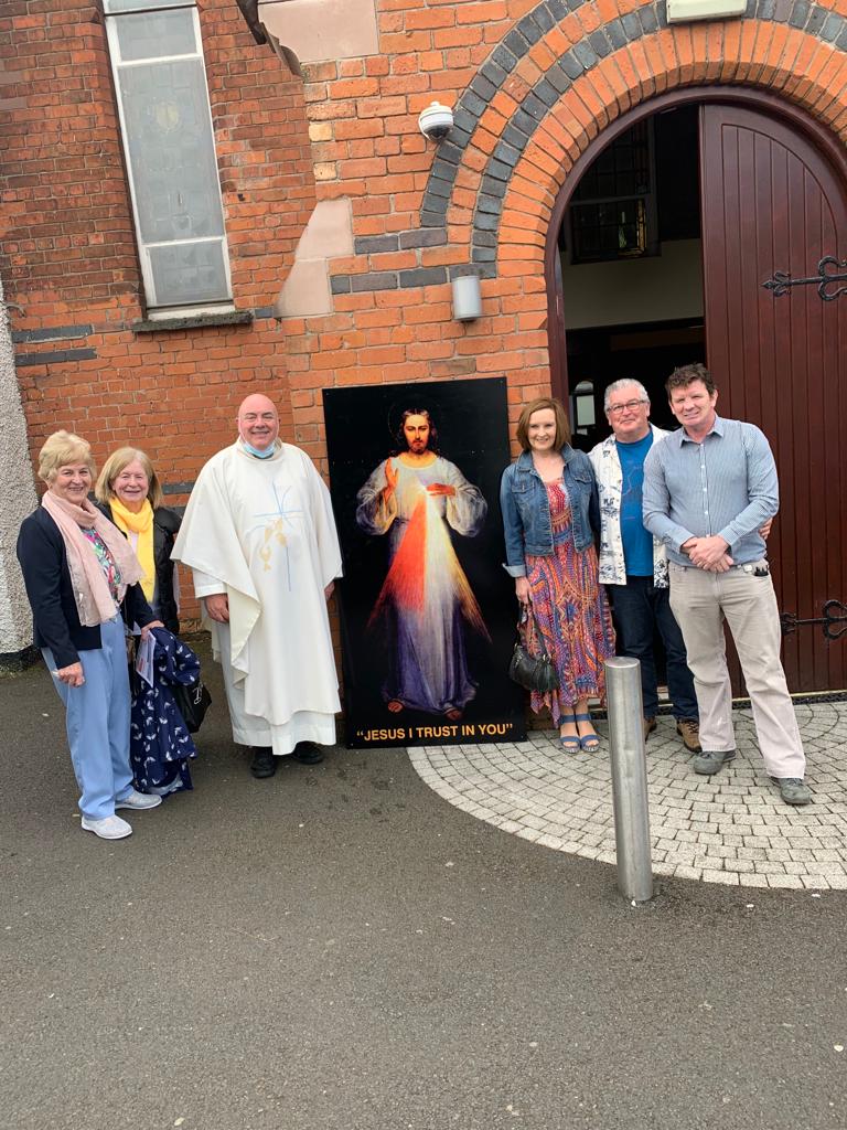 TRIBUTES: Fr Jim Madden with members of the Divine Mercy group of Sacred Heart Parish