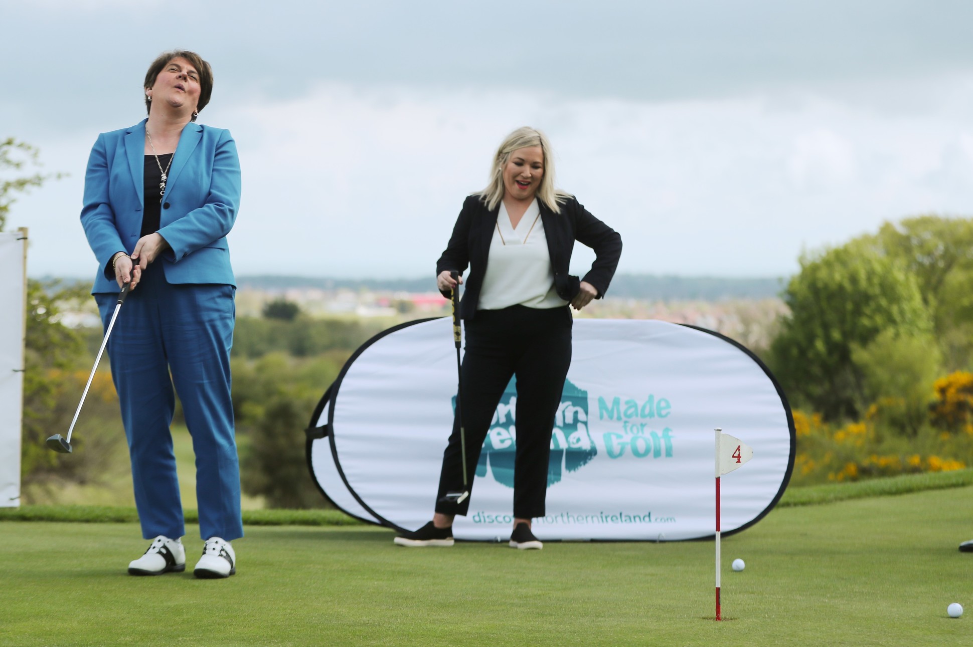 LAUGHTER: Niall Carson's photograph of Arlene Foster and Michelle O'Neill enjoying a round of golf won second prize in the 'Politics' category.