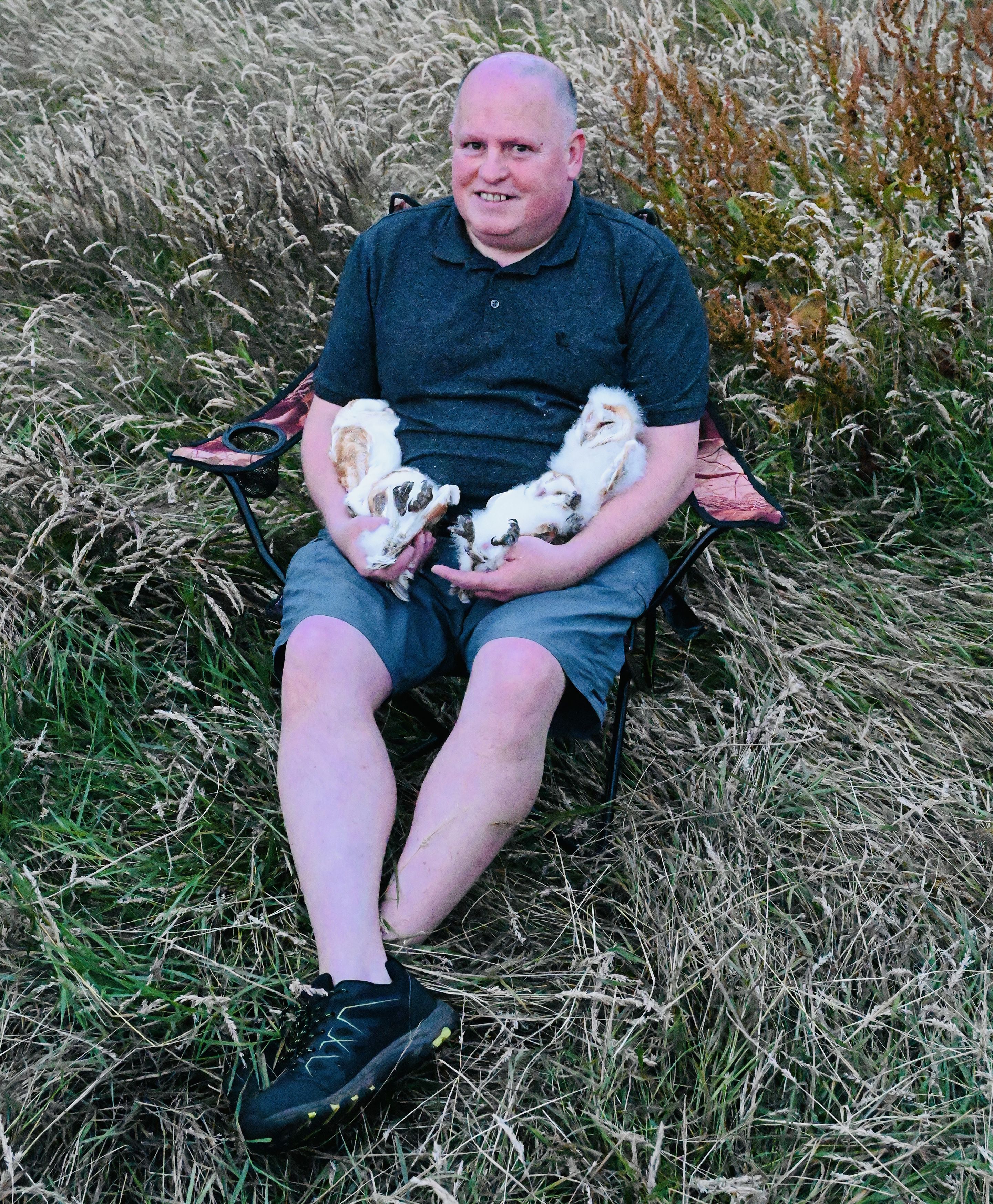 DEVOTION: Barn owl expert Ciarán Walsh with the four owlets