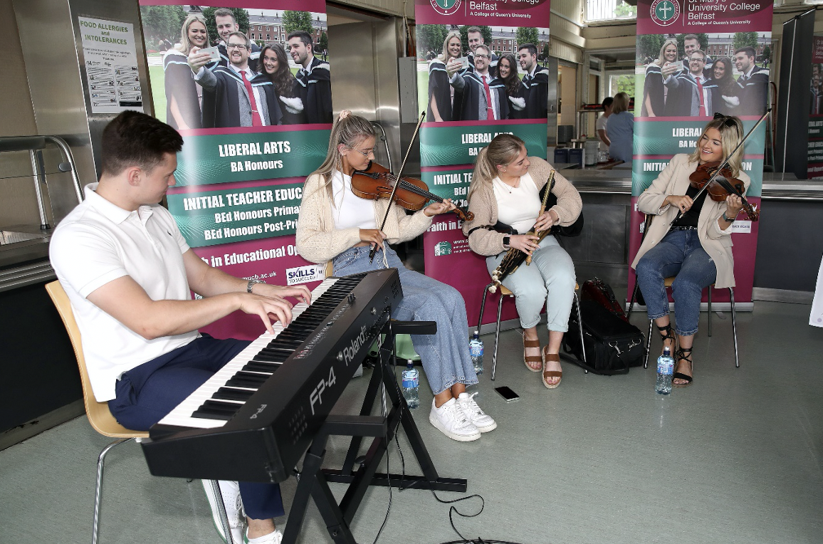 St Mary’s students Donal Close,  Molly Walls, Rosie McElroy, and Maeve O’Donnell liven up the celebrations with some Irish traditional music at the reception in the College dining hall 